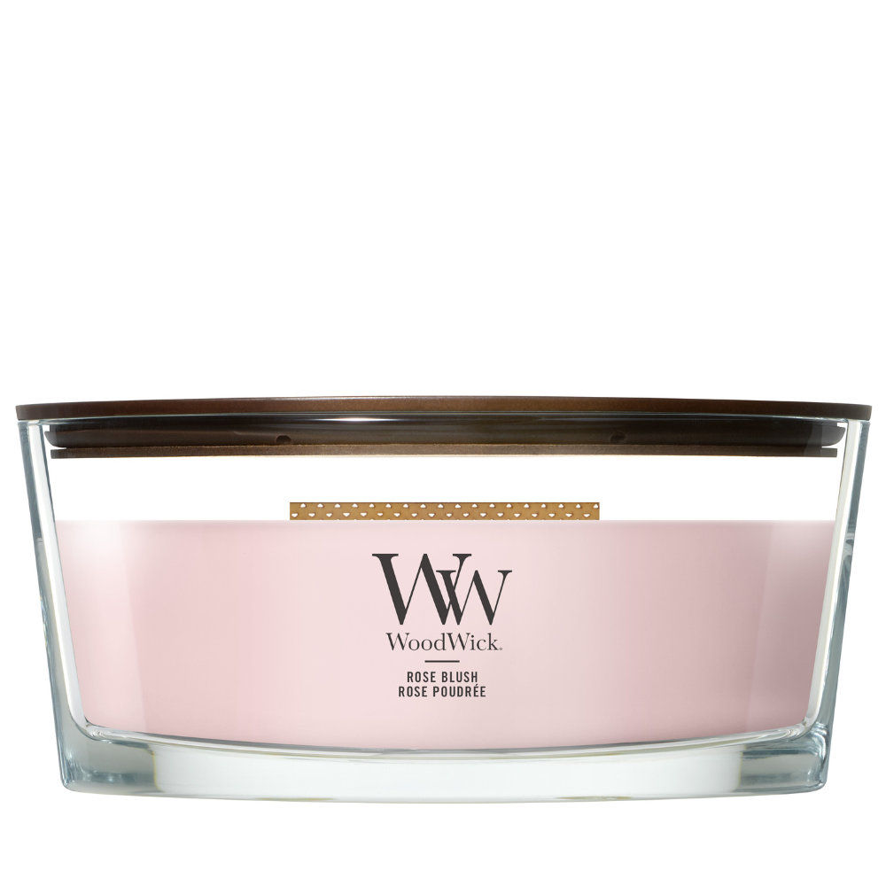 Rose Blush candle in a clear glass jar with a wooden lid.