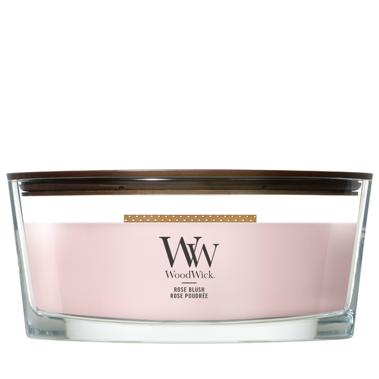 Rose Blush candle in a clear glass jar with a wooden lid.