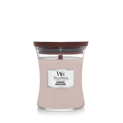 A WoodWick Rosewood scented candle in an hourglass-shaped glass jar with a dark wooden lid and label on a clean white background.