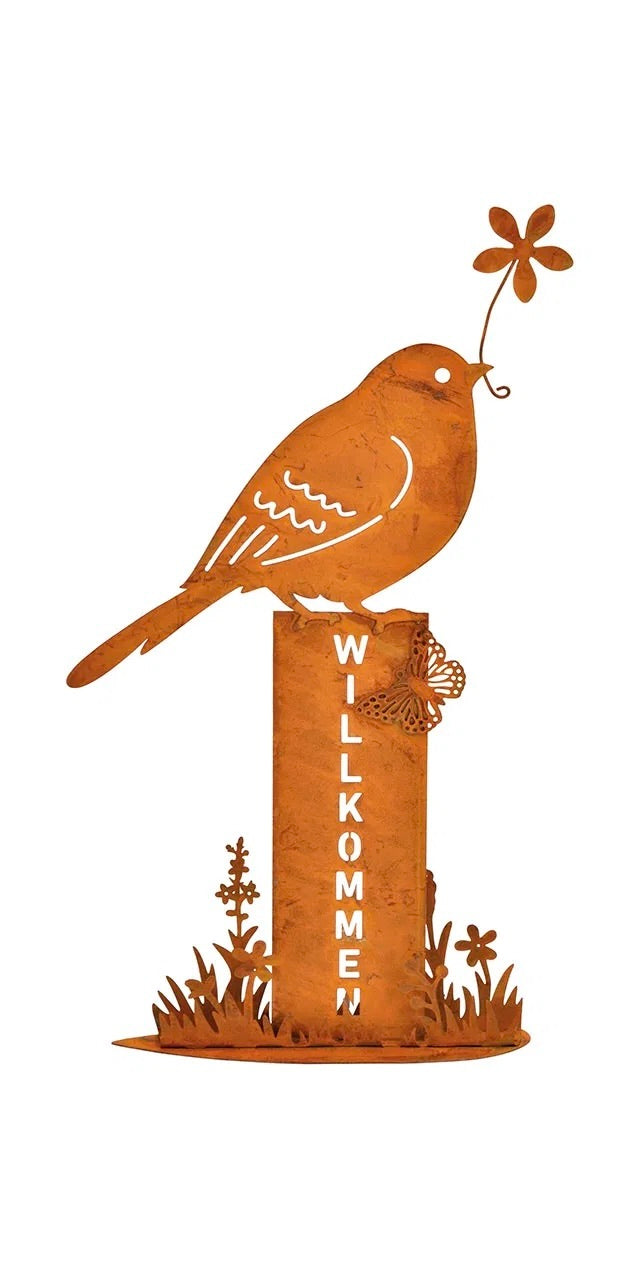 One metal bird stand with a rusty finish, featuring a bird holding a flower, mounted on posts with the word 'WELCOME' on it.