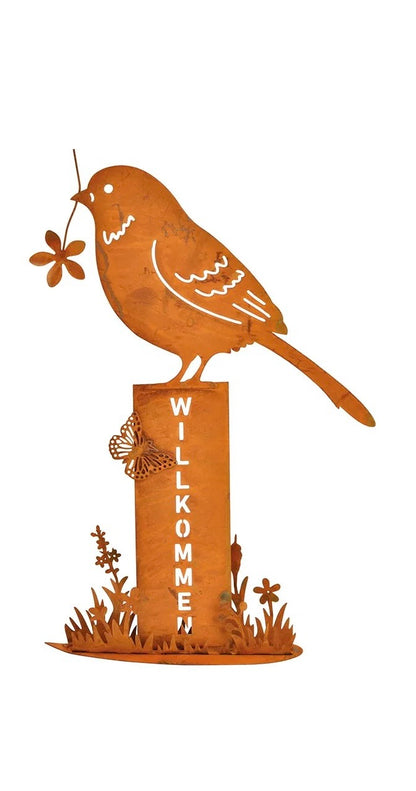 One metal bird stand with a rusty finish, featuring a bird holding a flower, mounted on posts with the word 'WELCOME' on it.
