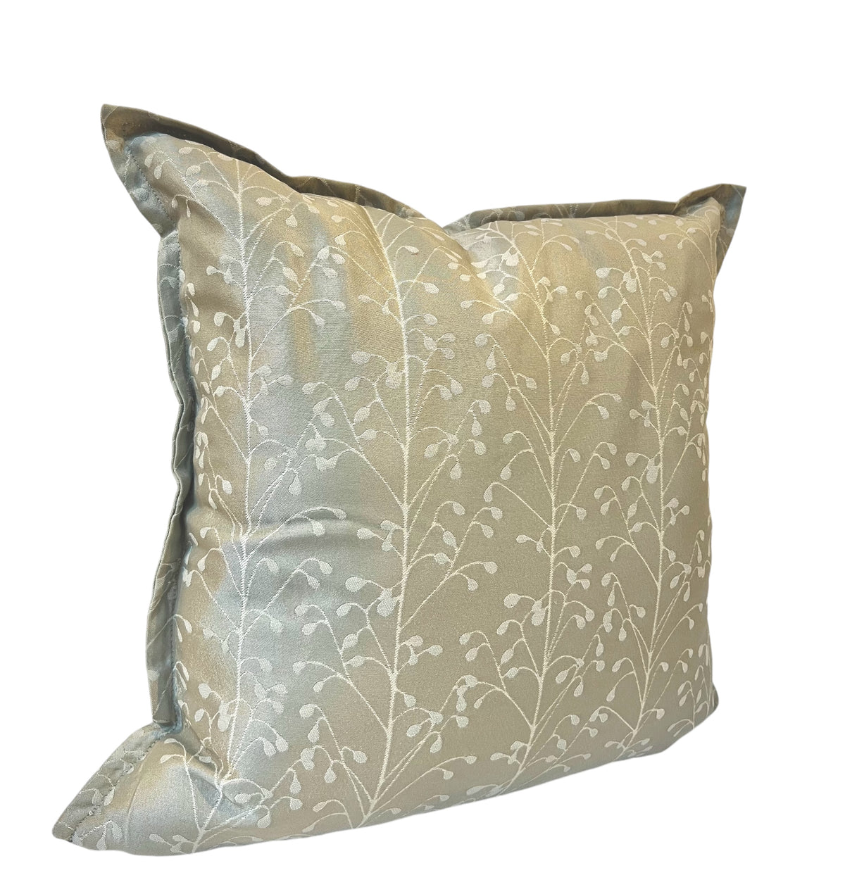 A square-shaped throw pillow with a leaf pattern in a beige color.