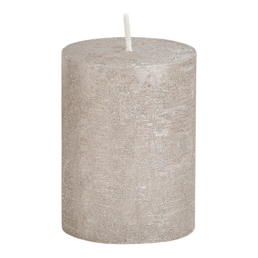 A cylindrical shimmer grey wax candle with a white wick, placed on a plain background.