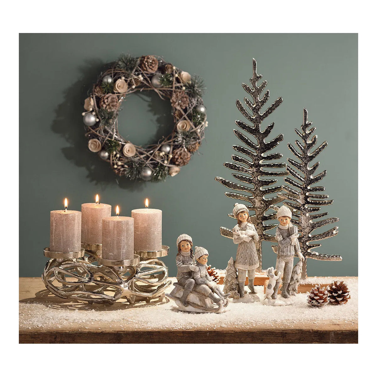 A cylindrical shimmer grey wax candle with a white wick, placed on a christmas background