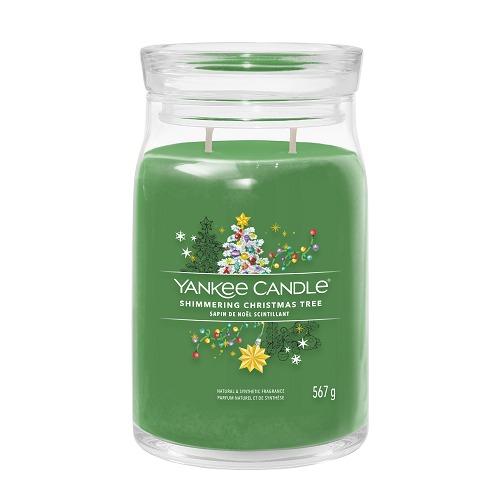 Green Yankee Candle with Christmas tree design on a white background