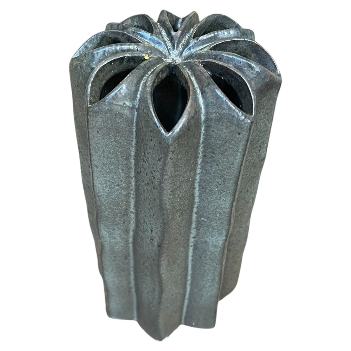 Decorative metal vase with a unique design on a white background