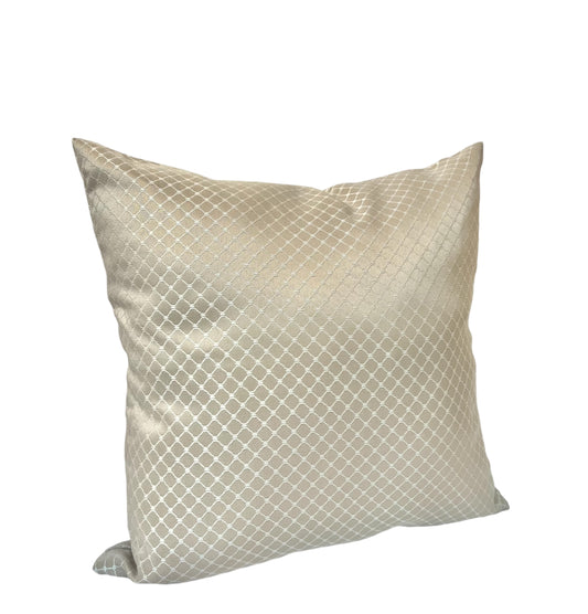 Light silver and champagne throw pillow featuring a subtle geometric grid pattern against a white background.