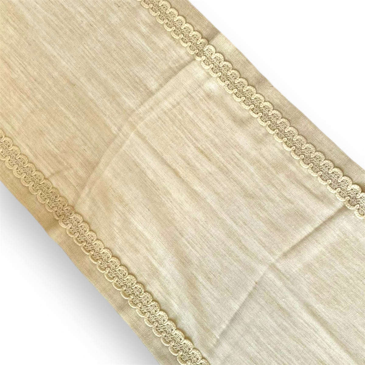 A beige lace runner with a scalloped edge and a smooth texture.