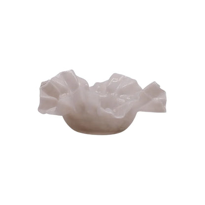 White ceramic sculpture on a white background