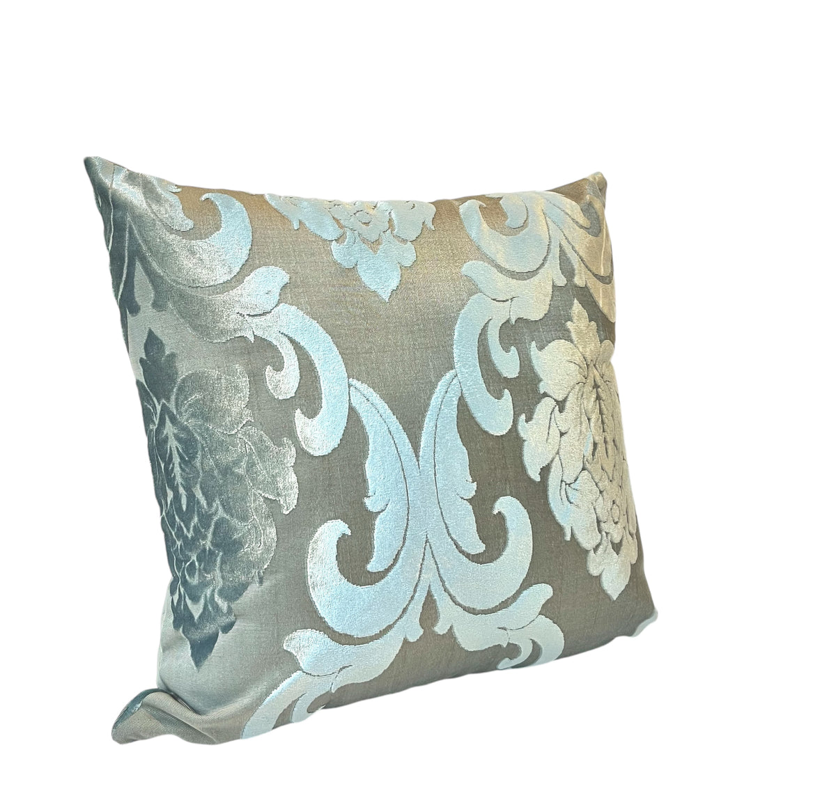 A square-shaped throw pillow with a silver and blue floral pattern.