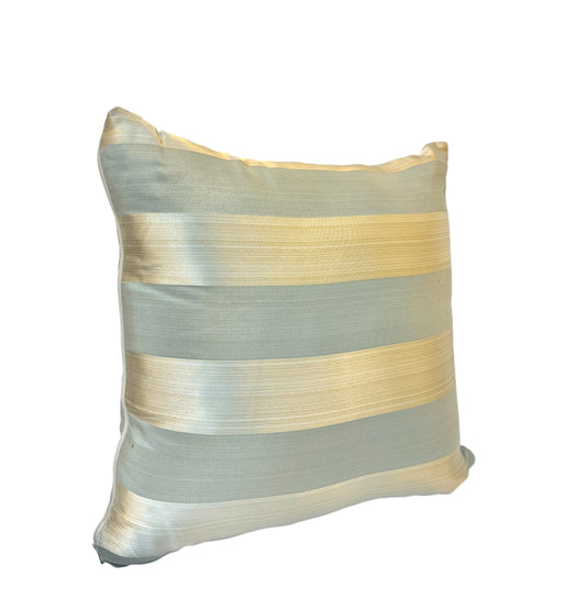 A square-shaped throw pillow with silver and gold stripes on a white background.