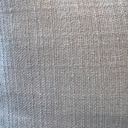 Extreme close-up detail of a textured linen fabric weave, showing woven threads in soft natural beige, cream, and warm grey tones.