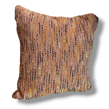 Square decorative throw pillow in a rich, multi-colored tweed weave featuring woven threads of terracotta, ochre yellow, brown, and soft purple against a plain white background.