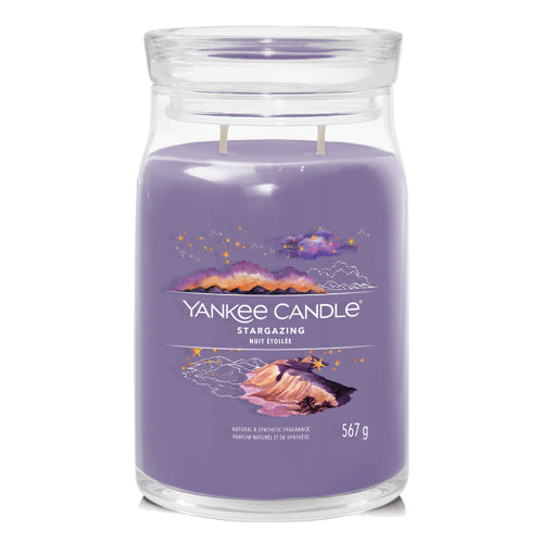 A jar candle with a purple label, titled 'YANKEE CANDLE STARGAZING', with a weight of 567g.