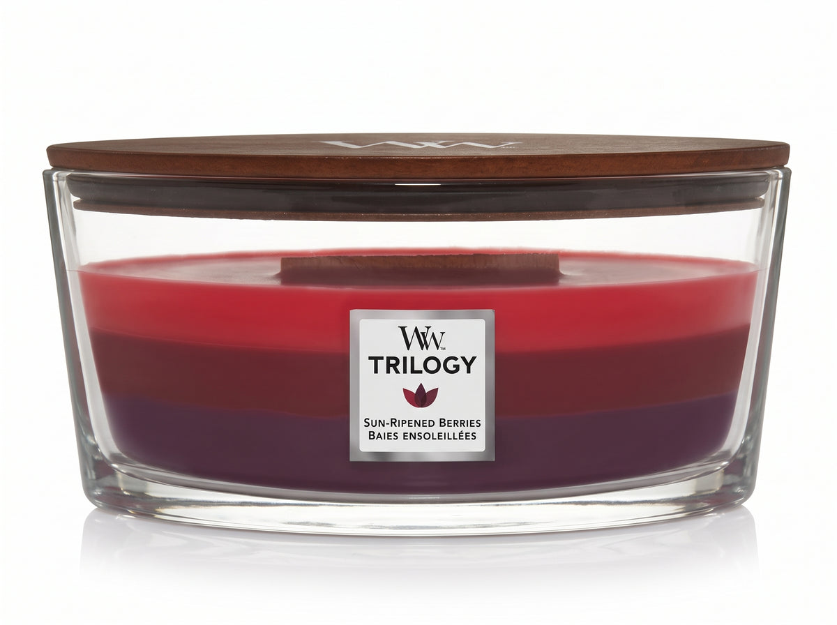 WoodWick Sun Ripened Berries candle in a clear glass jar with a wooden lid.