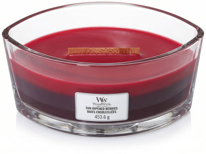 WoodWick Sun Ripened Berries candle in a clear glass jar with an open lid.