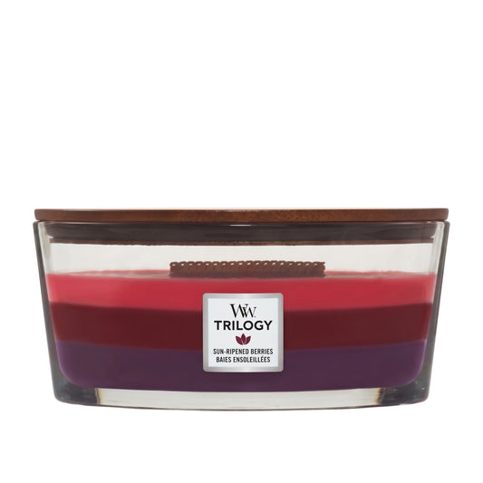 A three-layered wax candle in a clear rectangular glass container with a dark brown wooden lid. The wax layers are red on top, followed by dark red, and purple on the bottom.