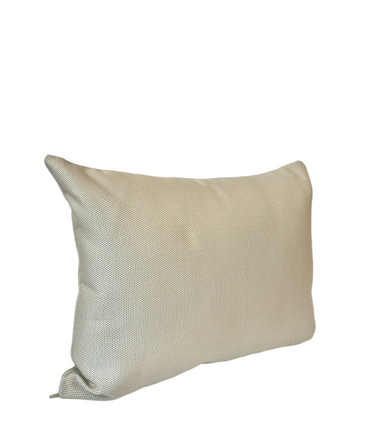 A beige rectangular pillow with a textured pattern.