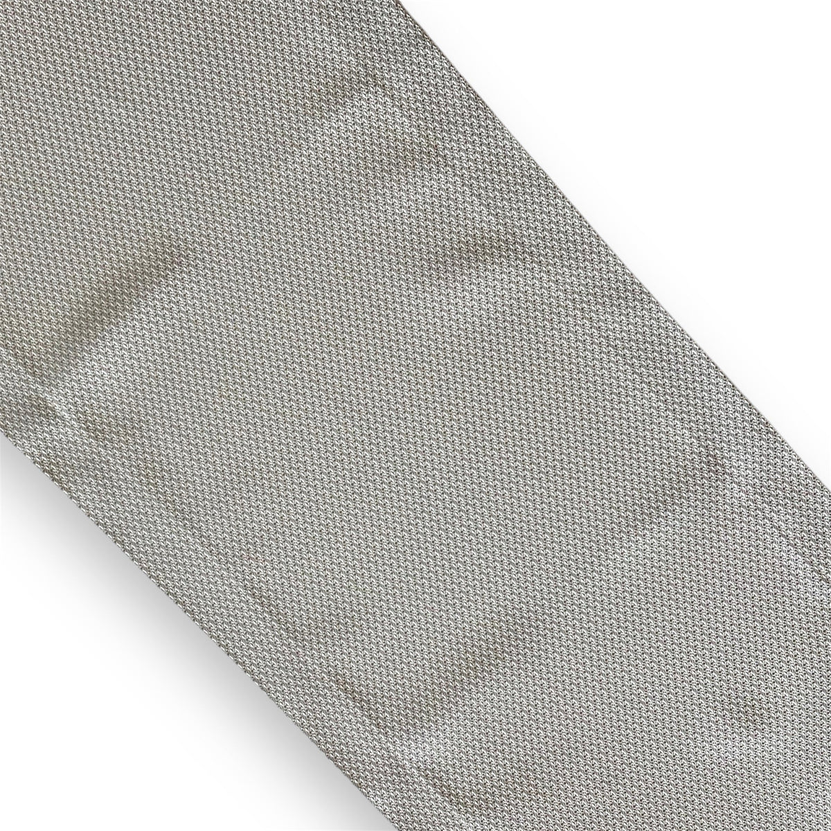Textured Grey Runner showcasing a fine houndstooth-style weave, displayed diagonally to highlight its intricate pattern and subtle elegance against a plain background.