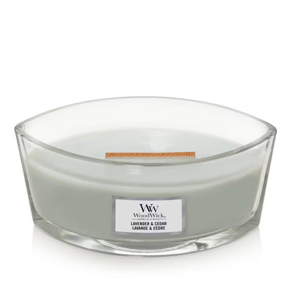 Unlid WoodWick Lavender & Cedar Ellipse Jar Candle with light sage green wax, a wooden wick,  centered against a clean white background.