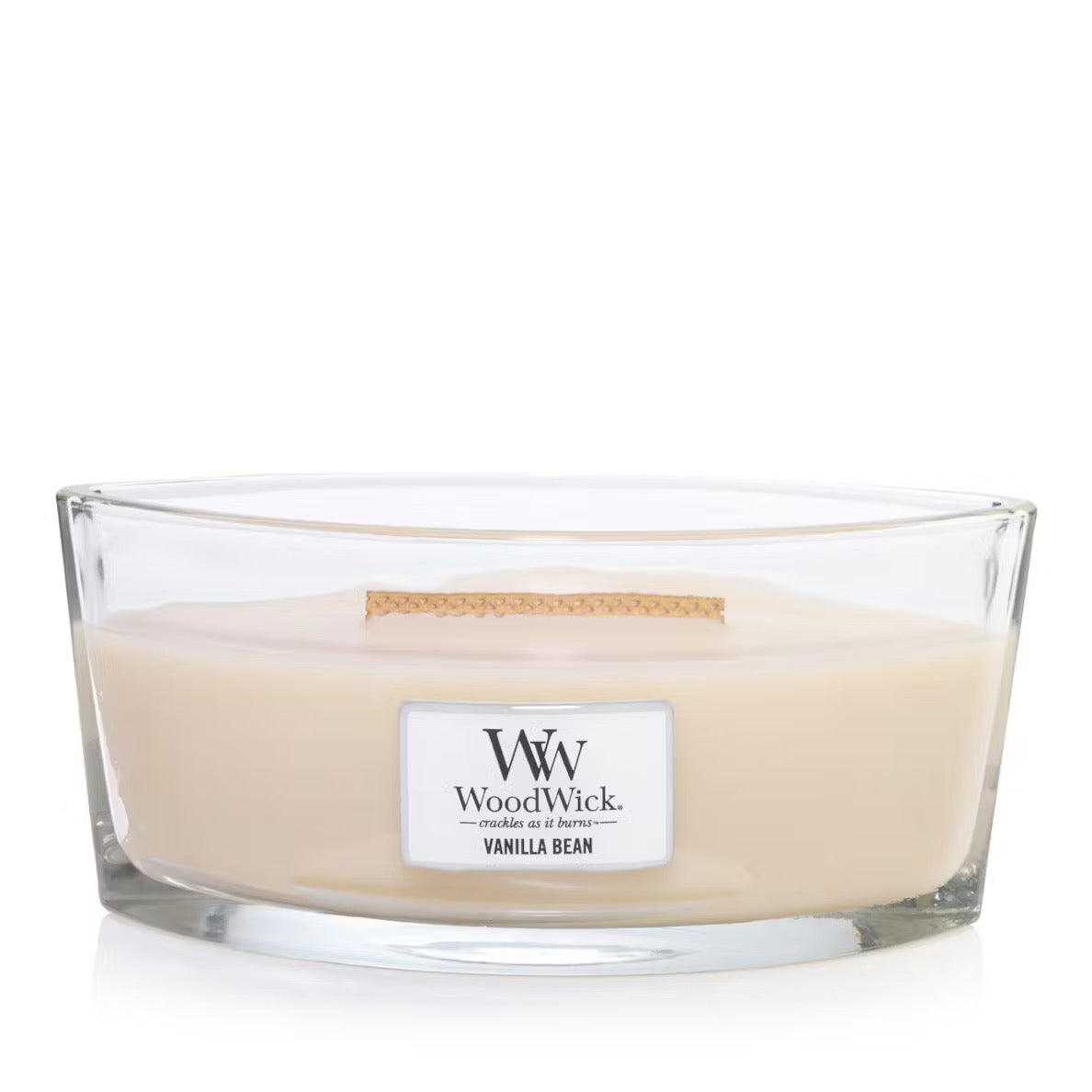 A clear ellipse-shaped jar candle with an opened lid, labeled 'W. Woodwick Vanilla Bean'.