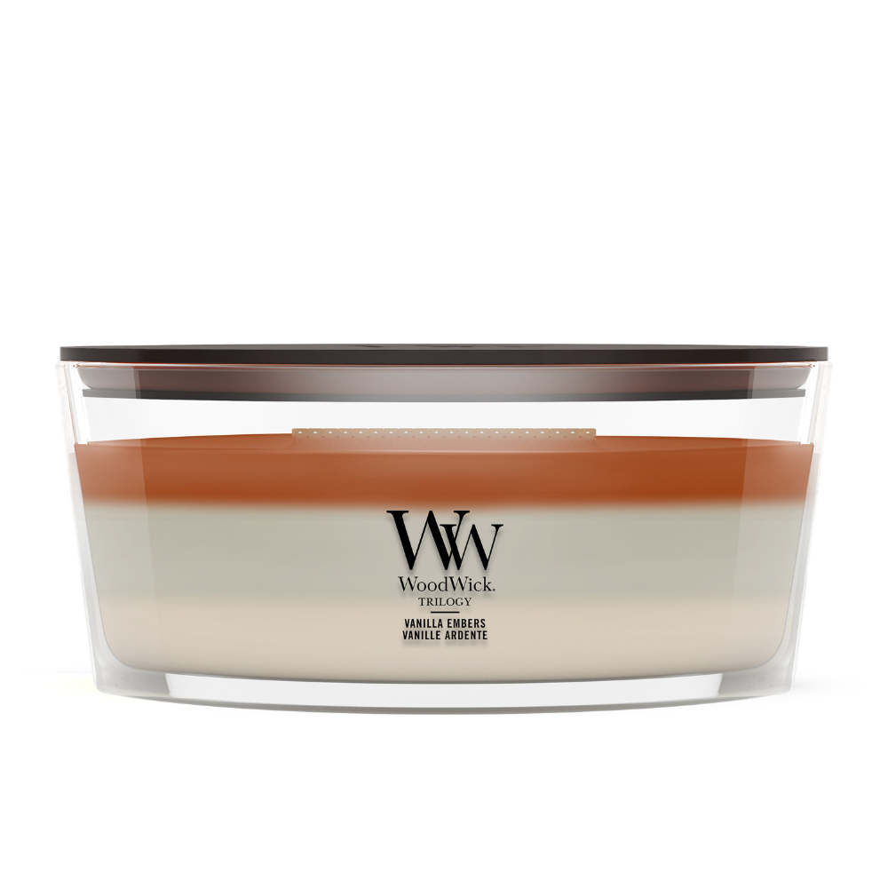 Vanilla Embers scented candle in a clear glass jar with a wooden lid.