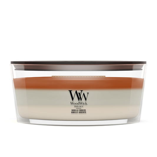 Vanilla Embers scented candle in a clear glass jar with a wooden lid.