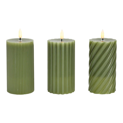 Three green LED wax candles with a flickering effect, each cylindrical in shape with a visible wick flame at the top.