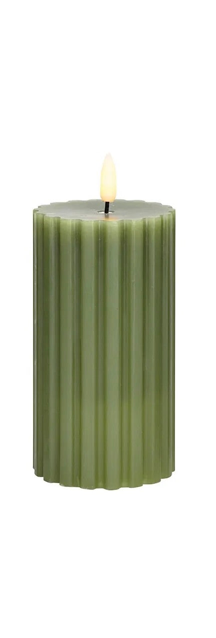 green LED wax candle with a flickering effect, in shape with a visible wick flame at the top.