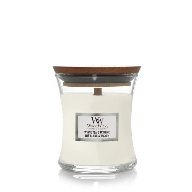 WoodWick candle with a wooden lid on a white background