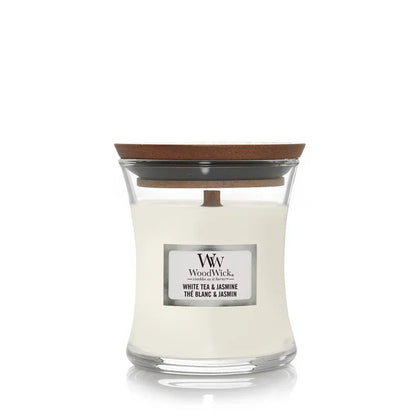 WoodWick candle with a wooden lid on a white background