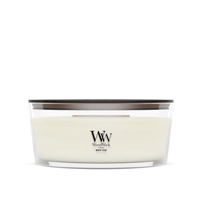 WoodWick White Teak ellipse candle in a clear glass jar with a wooden lid.
