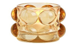 A beige bubble glass windlight with multiple bubble-shaped glass segments held together by a central supporting structure.