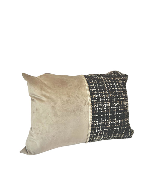 A square-shaped throw pillow with a two-tone design, featuring a beige velvet top and a patterned wicker bottom.