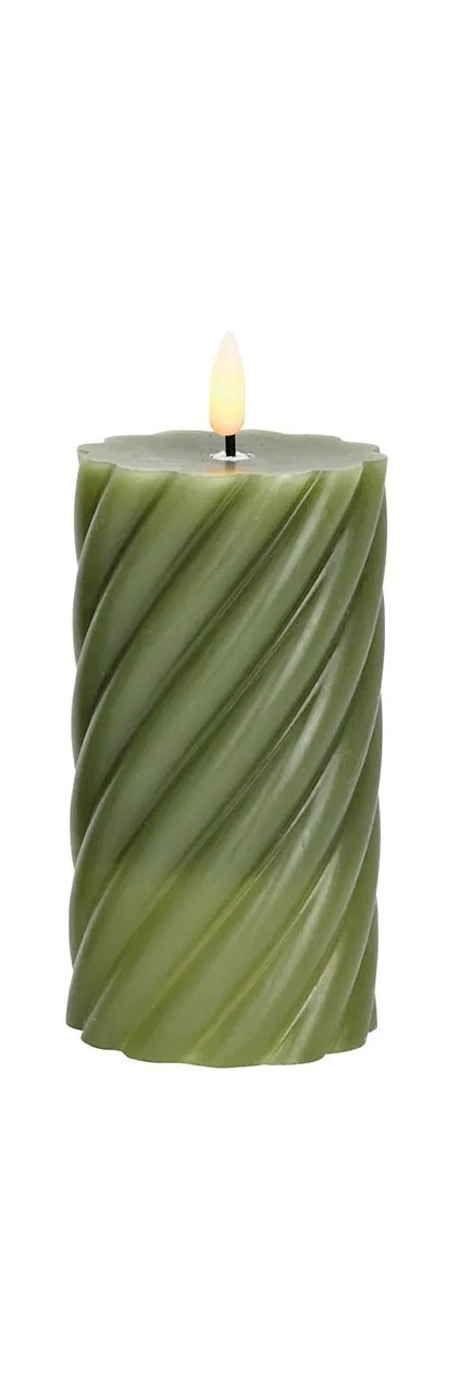 green LED wax candle with a flickering effect, in shape with a visible wick flame at the top.