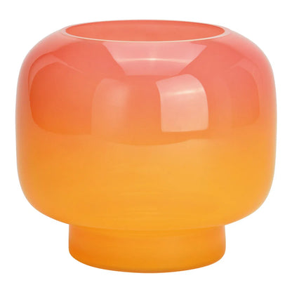 A round glass vase with a gradient color transition from pink to orange.
