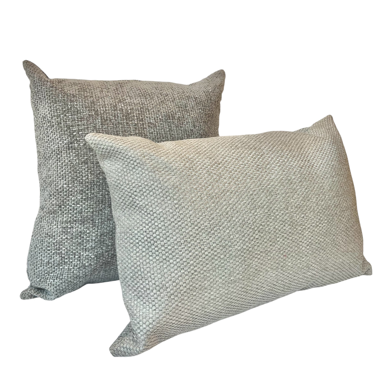 A square-shaped throw pillow with a textured beige fabric and a rectangular lighter grey textured fabric